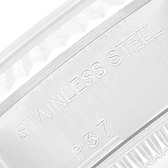 This close-up image shows part of the engraved case back, specifically the "Stainless Steel" marking on the Rolex Datejust 79174 Women's Stainless Steel Blue Dial 79174 Women's Stainless Steel Blue Dial watch.