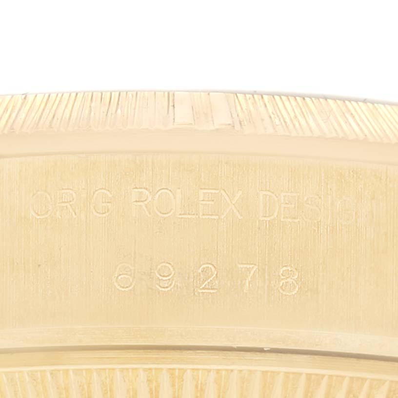 This image shows an angled close-up of the engraved inside case back of a Rolex President 69278 Women's Yellow Gold Champagne Dial 69278 Women's Yellow Gold Champagne Dial model watch.