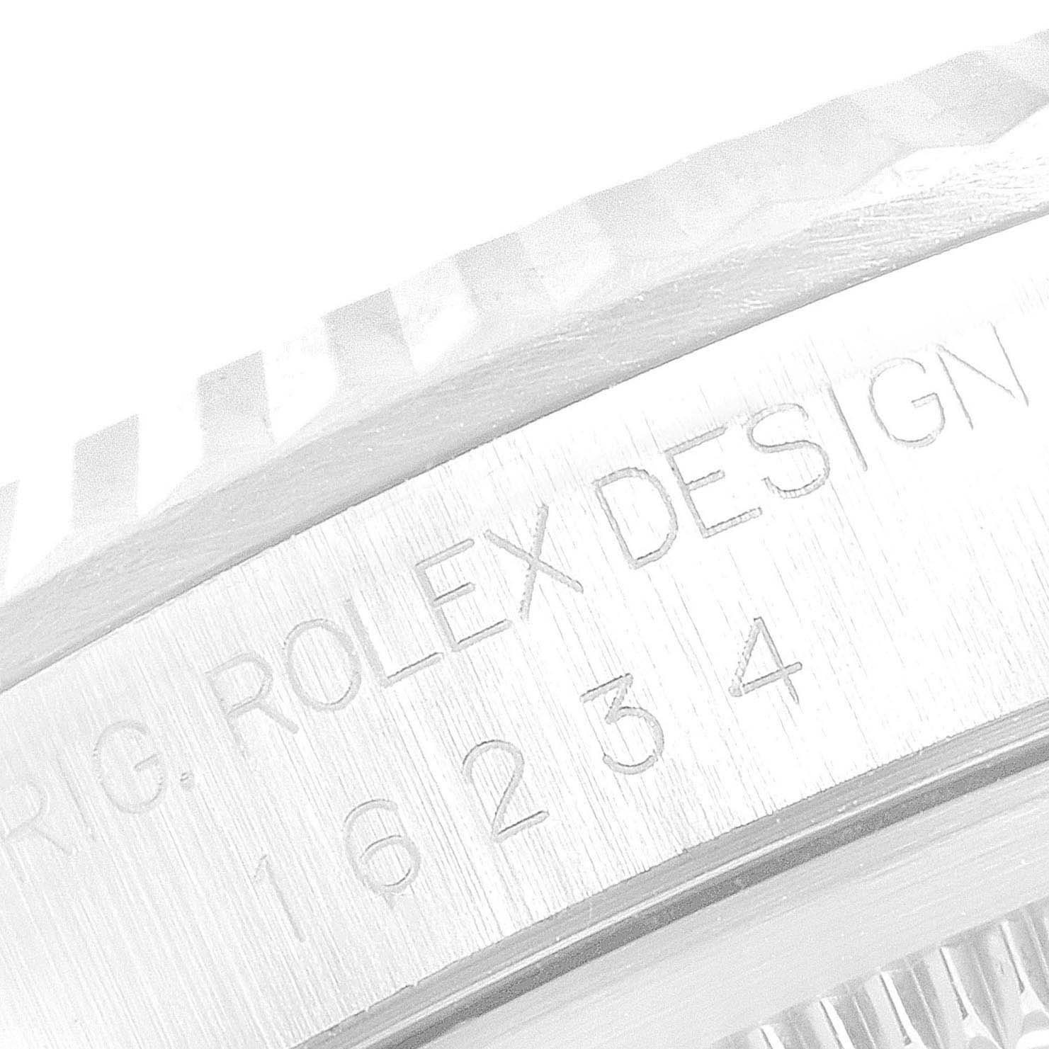 This image shows a close-up of the case with engraved text on a Rolex Datejust 16234 Men's Stainless Steel Black Dial 16234 Men's Stainless Steel Black Dial watch.