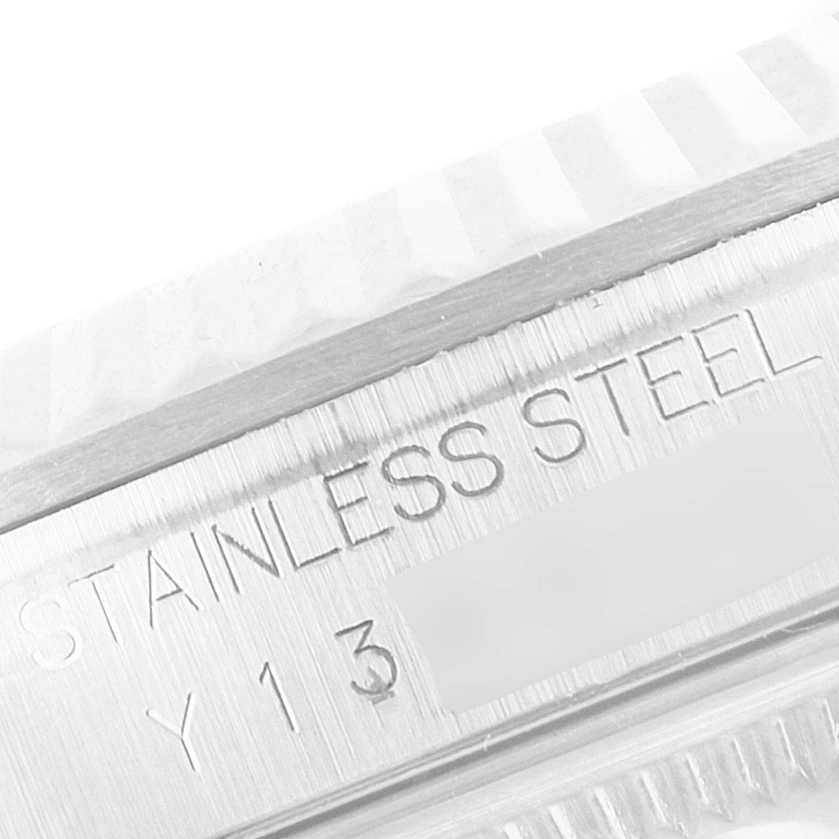 The image shows a close-up of the engraving on the side of the bezel of a Rolex Datejust 16234 Men's Stainless Steel Black Dial 16234 Men's Stainless Steel Black Dial watch, highlighting "STAINLESS STEEL."