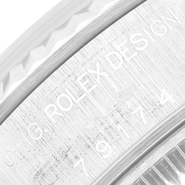 The image shows a close-up of the bezel and case side with the engraving on a Rolex Datejust 79174 Women's Stainless Steel Silver Dial 79174 Women's Stainless Steel Silver Dial watch.