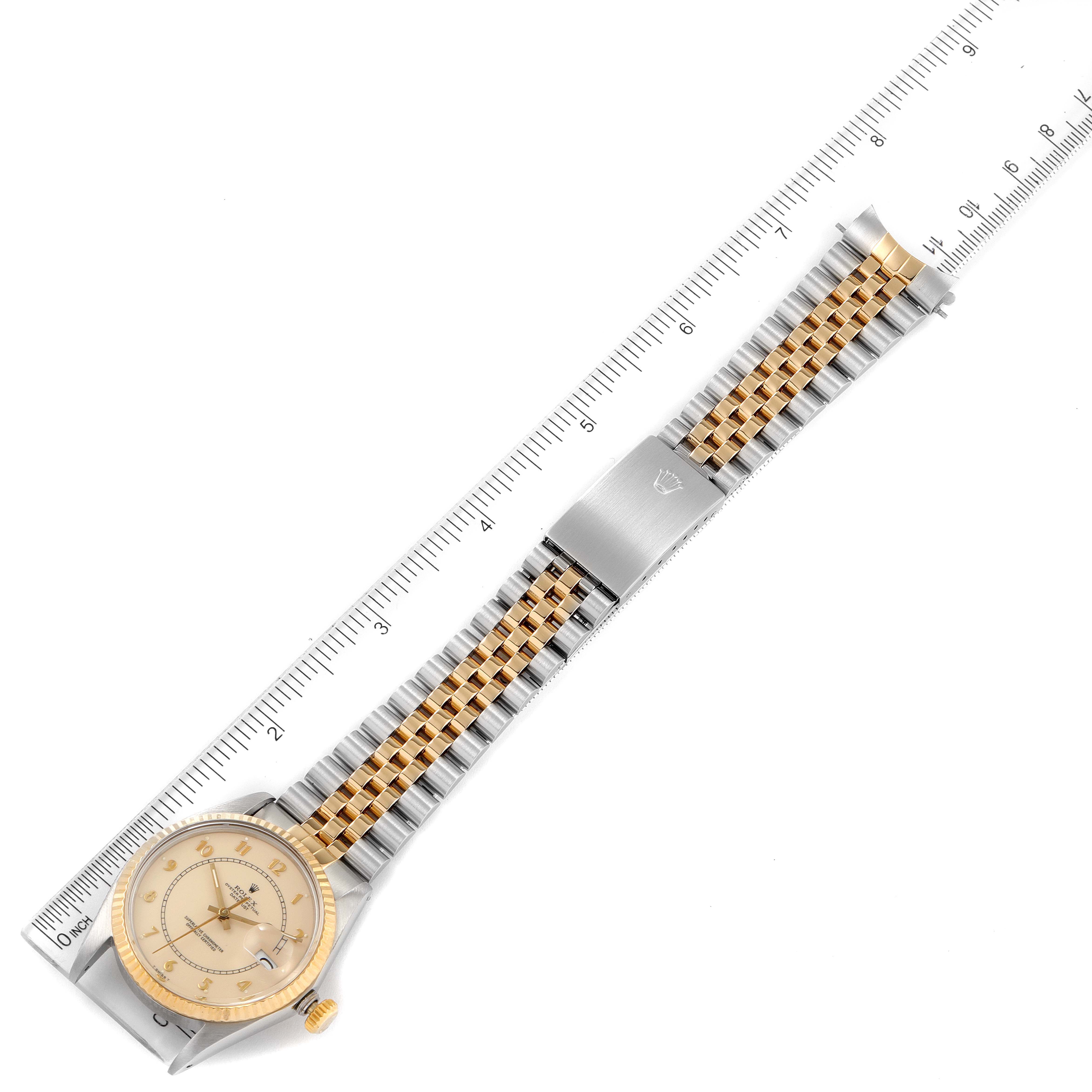 This image shows a Rolex Vintage Collection 16013 Men's Steel and Gold (two tone) Beige Dial 16013 Men's Steel and Gold (two tone) Beige Dial watch laid flat, displaying the face, two-tone bracelet, and clasp along with a ruler for scale.