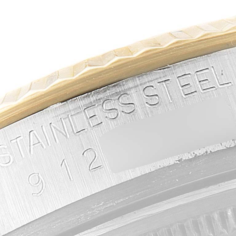 This close-up image of the Rolex Vintage Collection 16013 Men's Steel and Gold (two tone) Beige Dial 16013 Men's Steel and Gold (two tone) Beige Dial watch shows the side of the case, highlighting the stainless steel engraving.