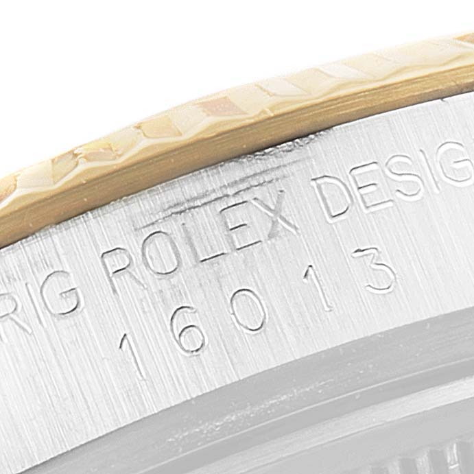 This image shows a close-up of the model number "16013" engraved on the case of a Vintage Collection Rolex watch.