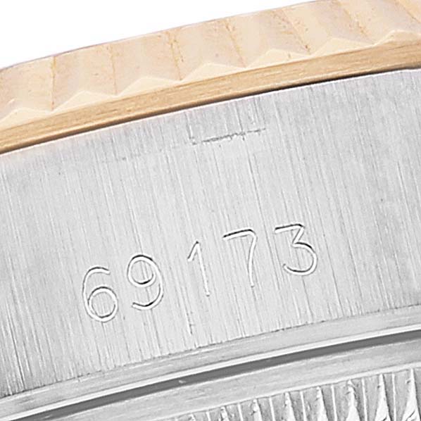 This image shows a close-up of the case side with model number engraving of a Rolex Datejust 69173 Women's Steel and Gold (two tone) Champagne Dial 69173 Women's Steel and Gold (two tone) Champagne Dial watch.