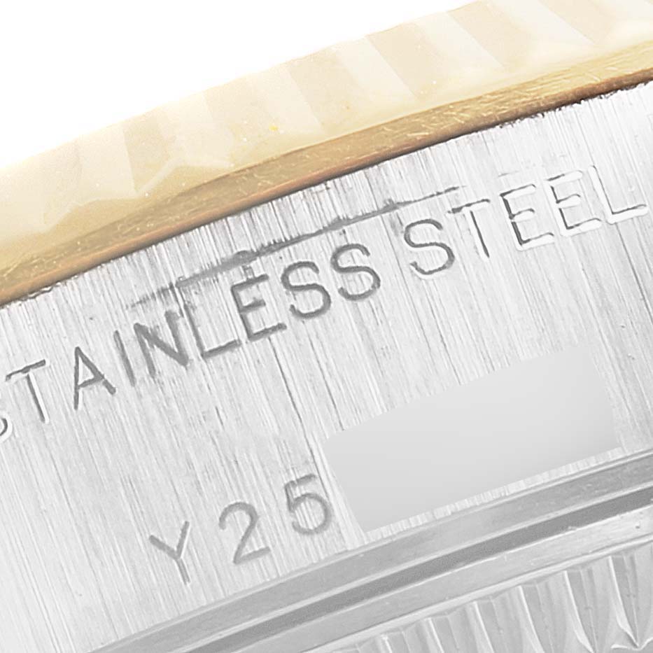 This close-up image shows the stainless steel part and reference engravings on the case back of a Rolex Datejust 79173 Women
s Steel and Gold (two tone) Champagne Dial 79173 Women
s Steel and Gold (two tone) Champagne Dial watch.