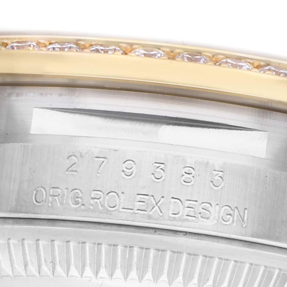 The image shows a close-up of the Rolex Datejust 279383RBR Women's Steel and Gold (two tone) Champagne Dial model with the engraving "ORIG. ROLEX DESIGN" and a portion of the bezel.