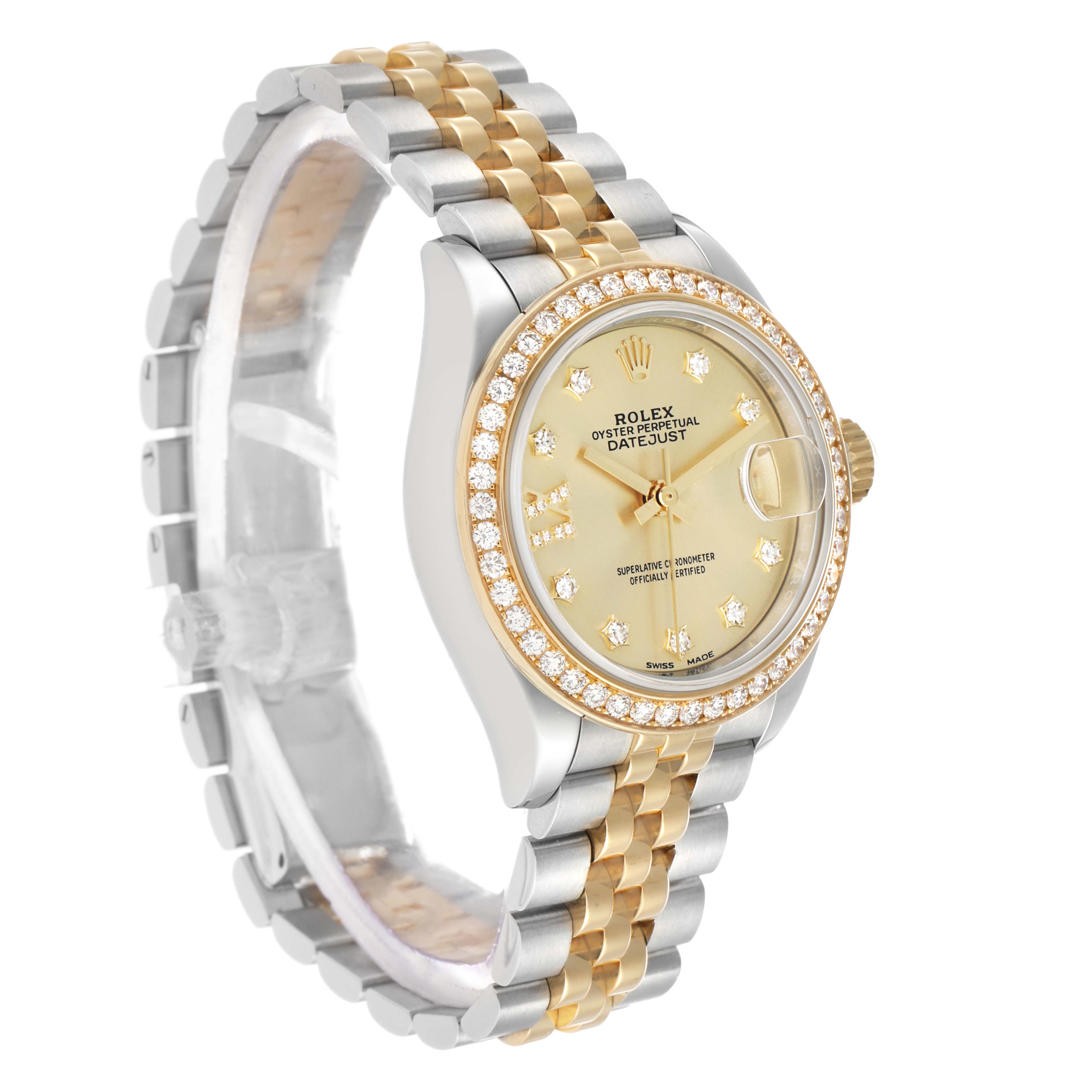 The Rolex Datejust 279383RBR Women's Steel and Gold (two tone) Champagne Dial watch is shown from a front-left angle, displaying the face, bezel, and part of the bracelet.