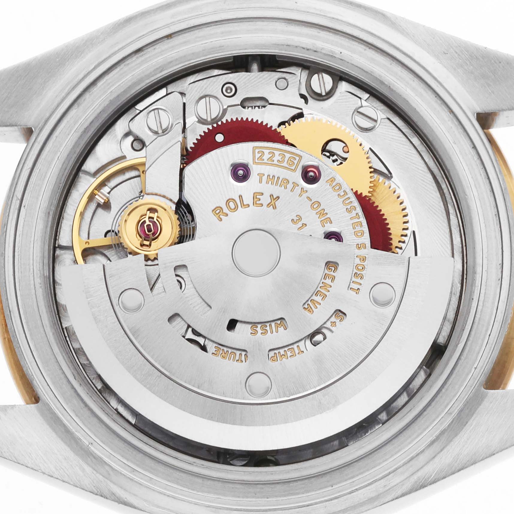 The image shows a close-up view of the movement inside a Rolex Datejust 279383RBR Women's Steel and Gold (two tone) Champagne Dial watch, highlighting gears and mechanical components.