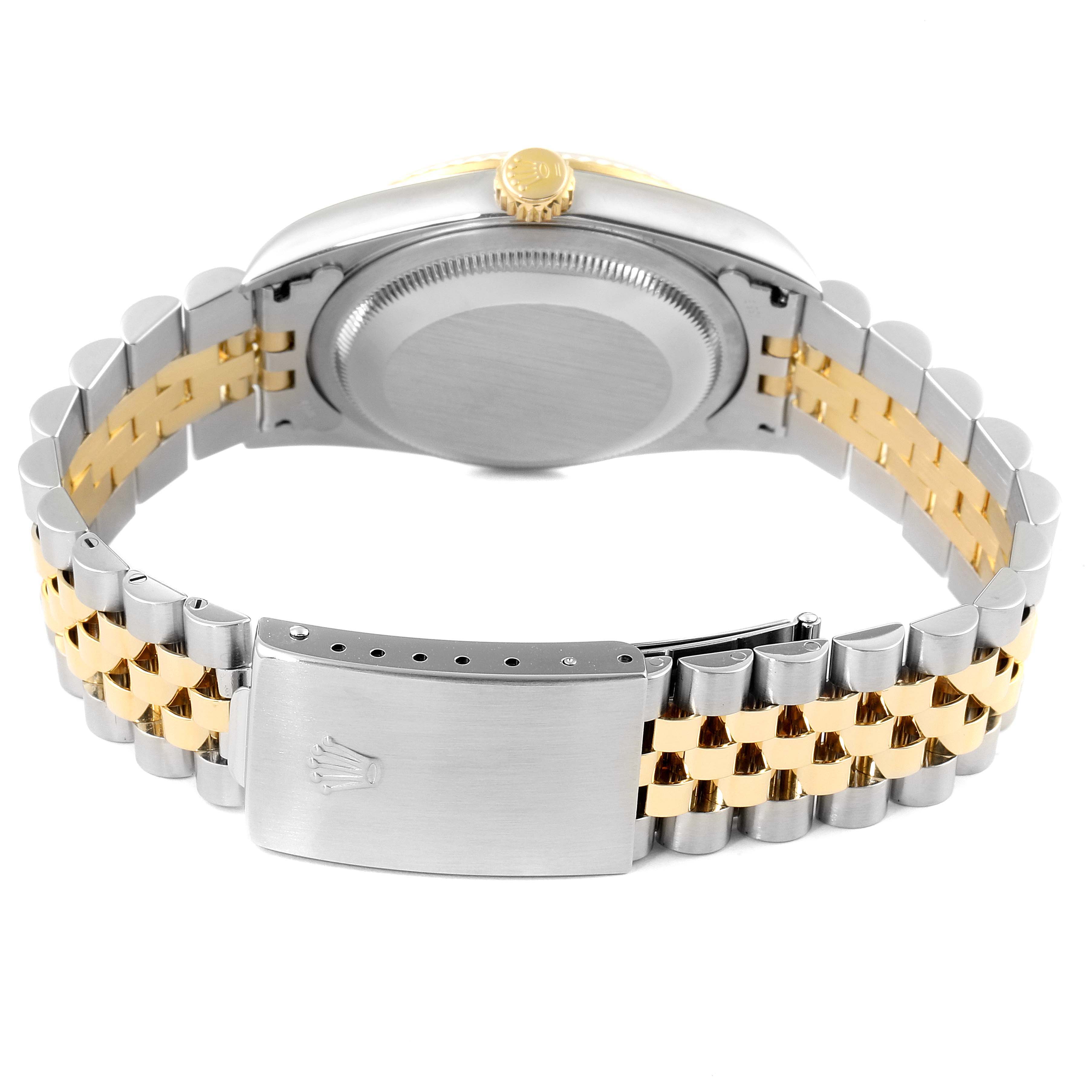 This image shows the back view of a Rolex Datejust 16233 Men
s Steel and Gold (two tone) Grey Dial 16233 Men
s Steel and Gold (two tone) Grey Dial watch, highlighting the case, crown, and two-tone Jubilee bracelet with clasp.