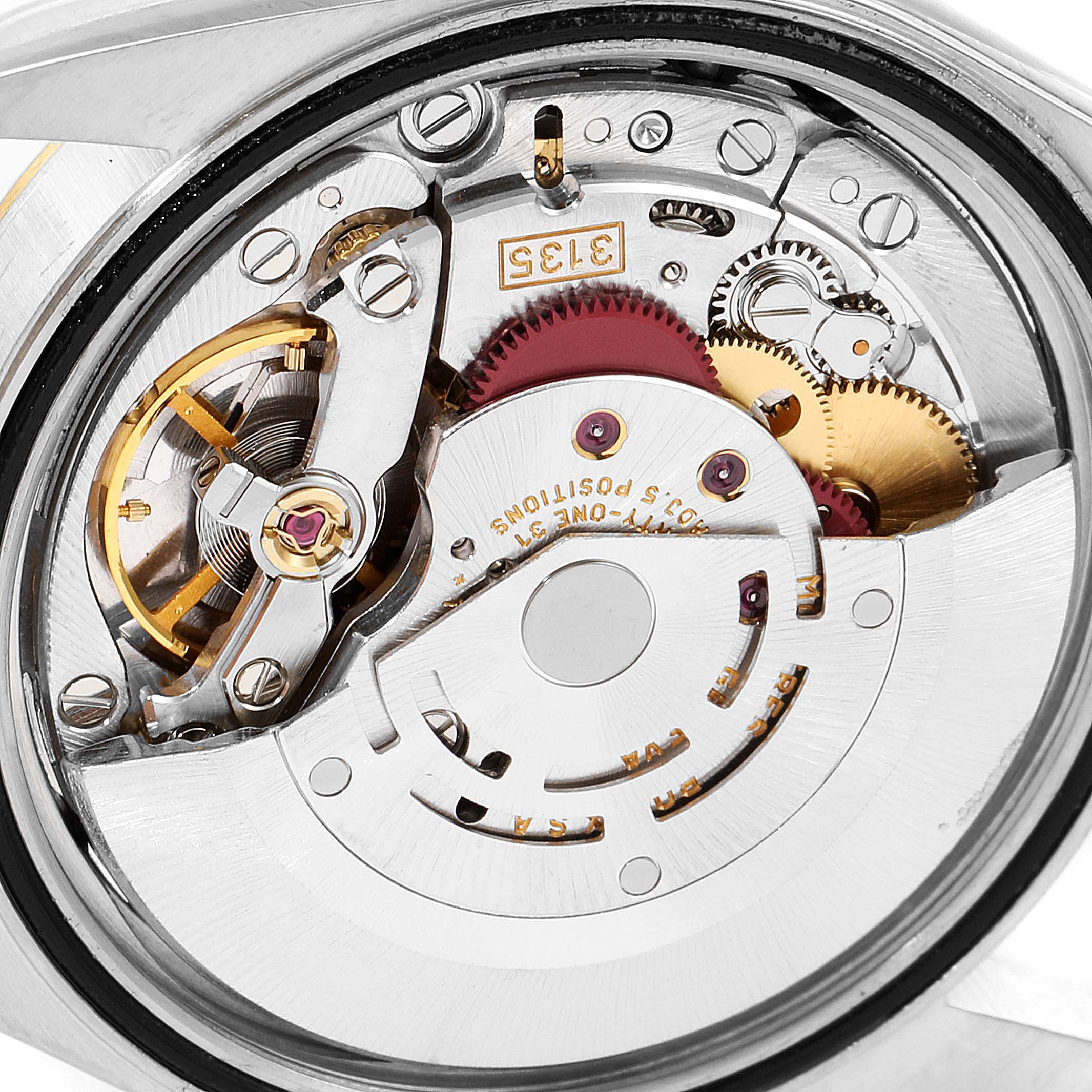 The image shows a close-up view of the movement mechanism of a Rolex Datejust 16233 Men
s Steel and Gold (two tone) Grey Dial 16233 Men
s Steel and Gold (two tone) Grey Dial watch, focusing on its intricate components.