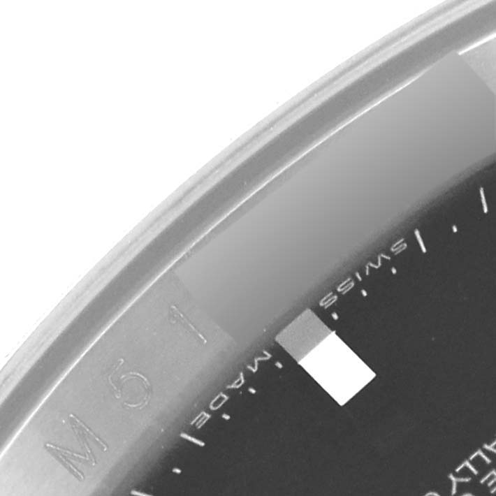This close-up image shows the bezel and part of the dial of the Rolex Turn-o-Graph 116264 Men
s Stainless Steel Black Dial 116264 Men
s Stainless Steel Black Dial model watch.
