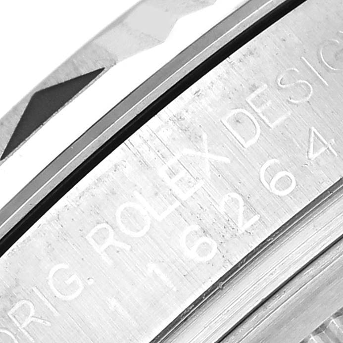 The image shows a close-up of the bezel and engraving on the side of the Rolex Turn-o-Graph 116264 Men
s Stainless Steel Black Dial 116264 Men
s Stainless Steel Black Dial model.