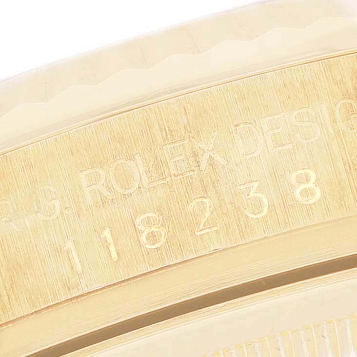 This close-up image shows the engraved model number on the golden case edge of a Rolex President 118238 Men's Yellow Gold Mother of Pearl Dial 118238 Men's Yellow Gold Mother of Pearl Dial watch.