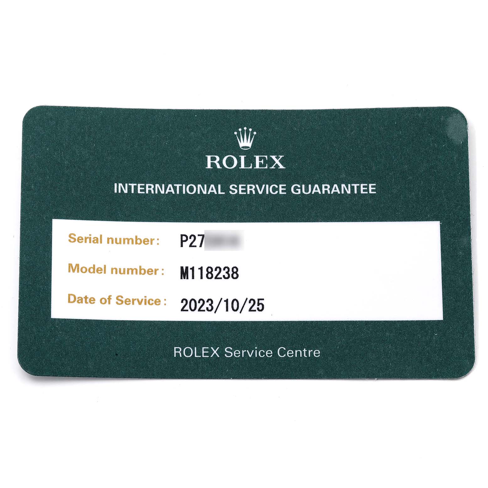 The image shows a Rolex International Service Guarantee card for the President model, displaying the serial and model numbers, and date of service.