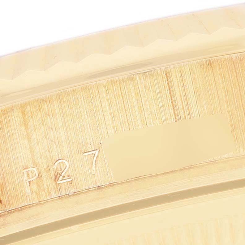 The image shows a close-up of the case with engravings from a Rolex President 118238 Men's Yellow Gold Mother of Pearl Dial 118238 Men's Yellow Gold Mother of Pearl Dial model watch.