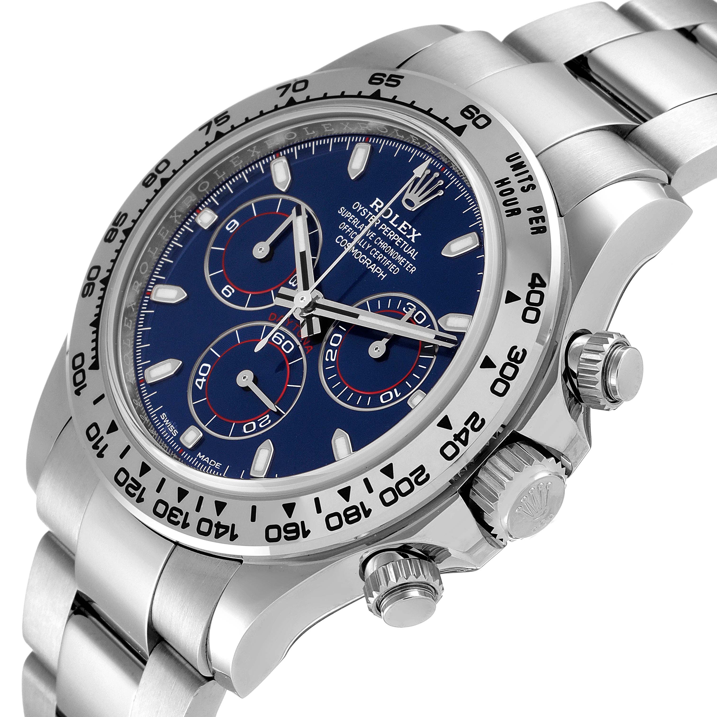 The Rolex Daytona 116509 Men's White Gold Blue Dial 116509 Men's White Gold Blue Dial watch is shown at an angle, displaying its face, bezel, crown, and part of the bracelet.