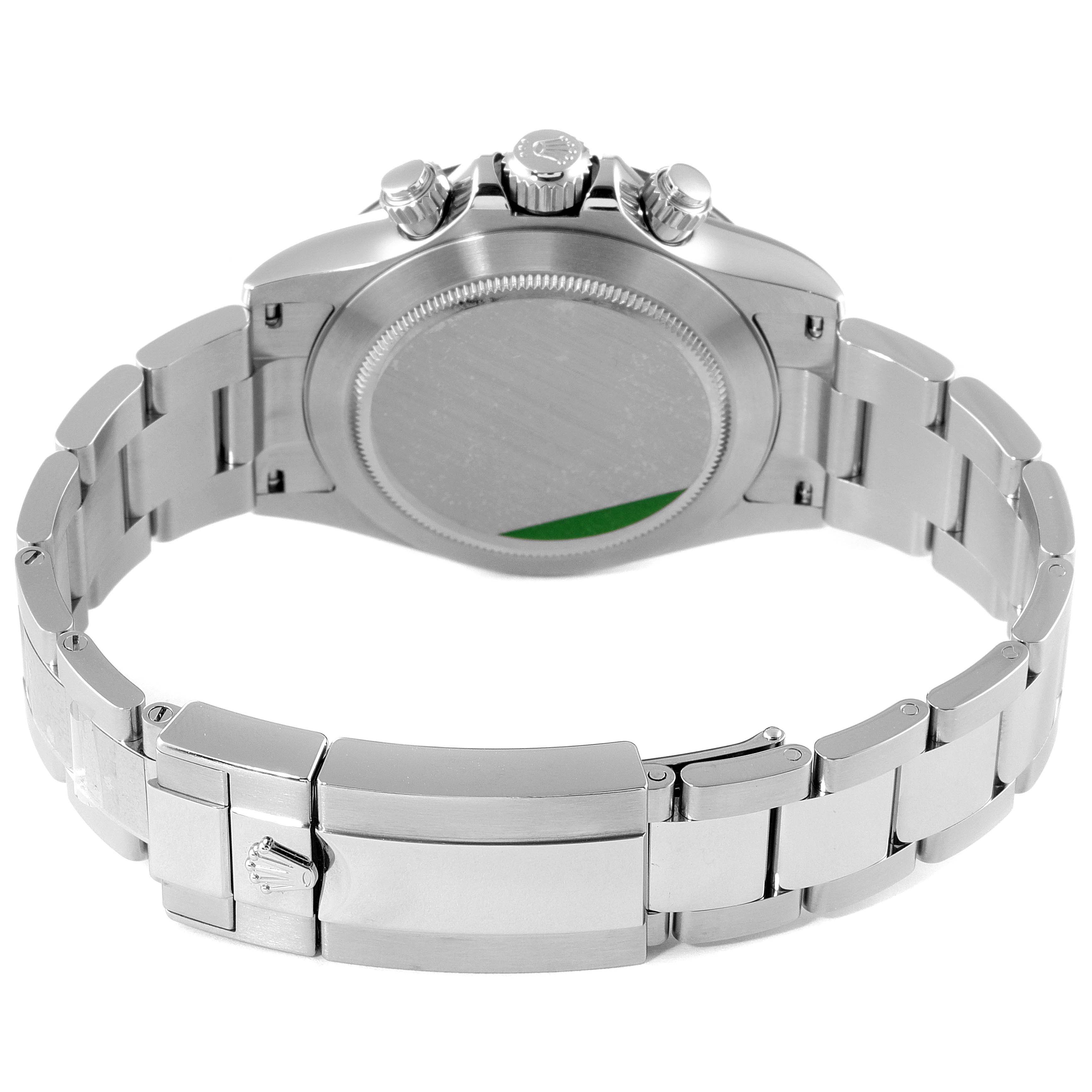 This image shows the back view of a Rolex Daytona 116500 Men's Stainless Steel White Dial 116500 Men's Stainless Steel White Dial watch, focusing on the case back and partially open metal bracelet.