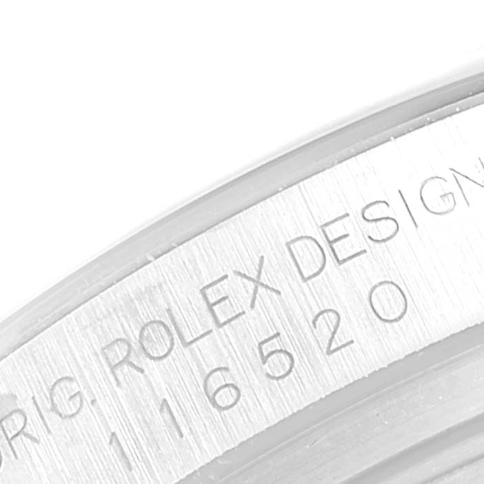The image shows a close-up of the inner rim of a Rolex Daytona 116520 Men's Stainless Steel White Dial 116520 Men's Stainless Steel White Dial watch case, highlighting its engraved serial number.