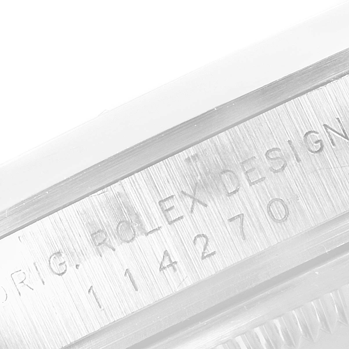 This image shows a close-up of the engraved model number and text on the side of the Rolex Explorer 114270 Men
s Stainless Steel Black Dial 114270 Men
s Stainless Steel Black Dial watch case.