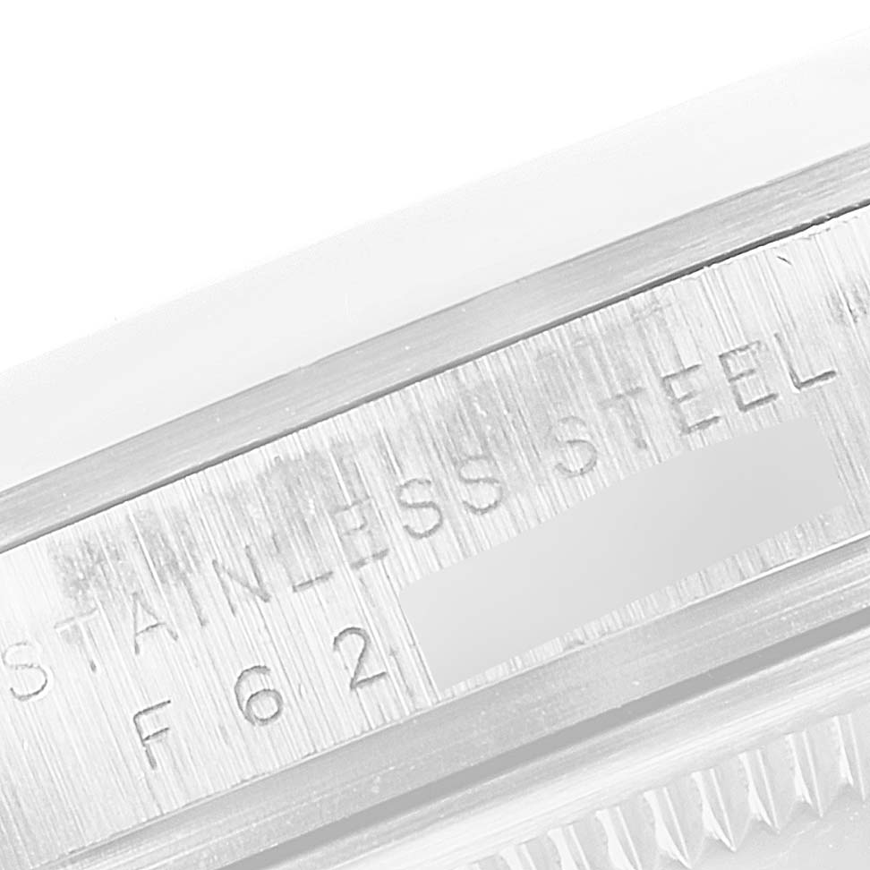 This image shows a close-up of the serial and material engraving on the case back side of a Rolex Explorer 114270 Men
s Stainless Steel Black Dial 114270 Men
s Stainless Steel Black Dial watch.