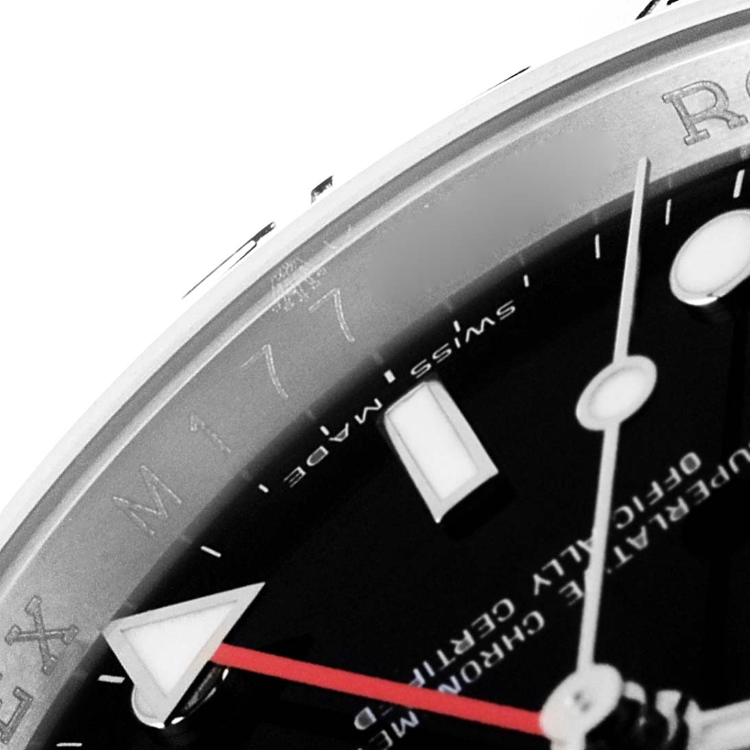This close-up angle of the Rolex Explorer 16570 Men
s Stainless Steel Black Dial 16570 Men
s Stainless Steel Black Dial watch shows a portion of the dial, hands, and part of the bezel with "Swiss made" text.