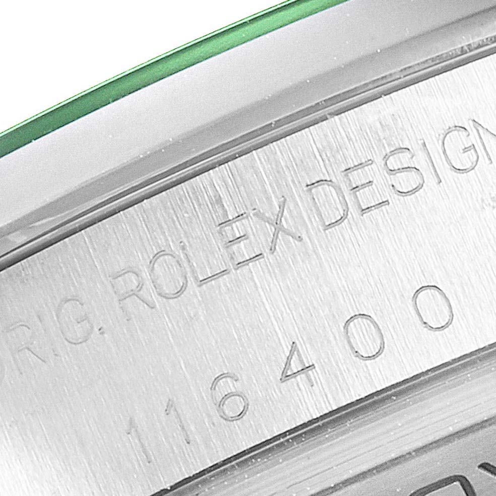 The image shows an angled view of the side of a Rolex Milgauss 116400GV Men
s Stainless Steel Black Dial 116400GV Men
s Stainless Steel Black Dial watch, highlighting the engraved model number and part of the bezel.