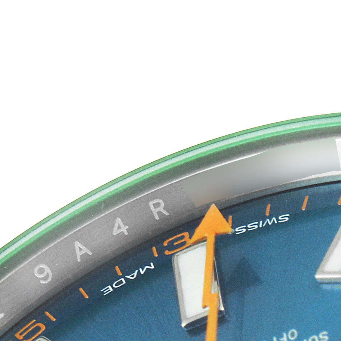 The image shows a close-up of the dial with an orange arrow hour hand and part of the bezel of a Rolex Milgauss 116400GV Men
s Stainless Steel Blue Dial 116400GV Men
s Stainless Steel Blue Dial watch.
