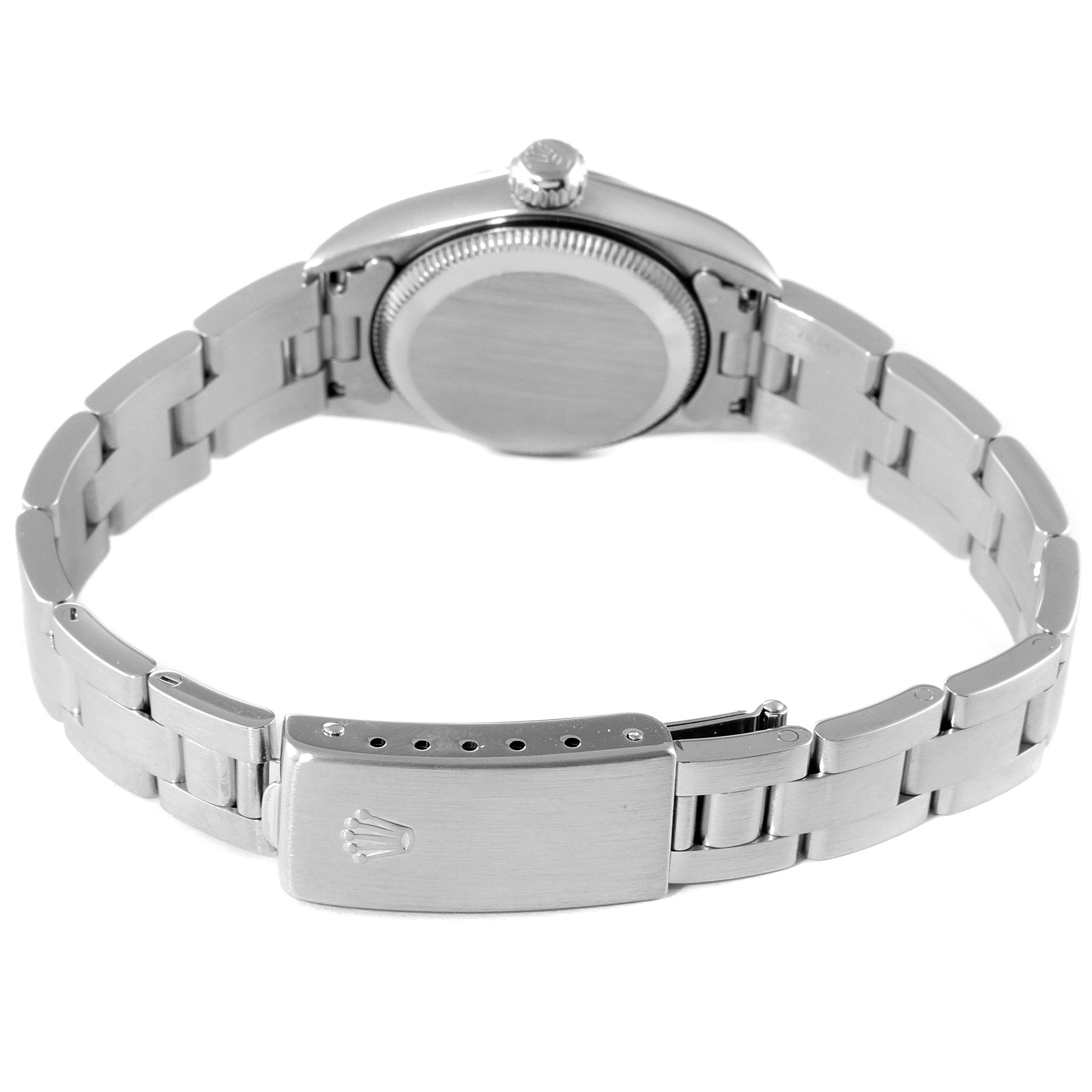 This image shows the back view of a Rolex Oyster Perpetual 67180 Women's Stainless Steel Black Dial 67180 Women's Stainless Steel Black Dial watch, highlighting the case back and the bracelet with its clasp.