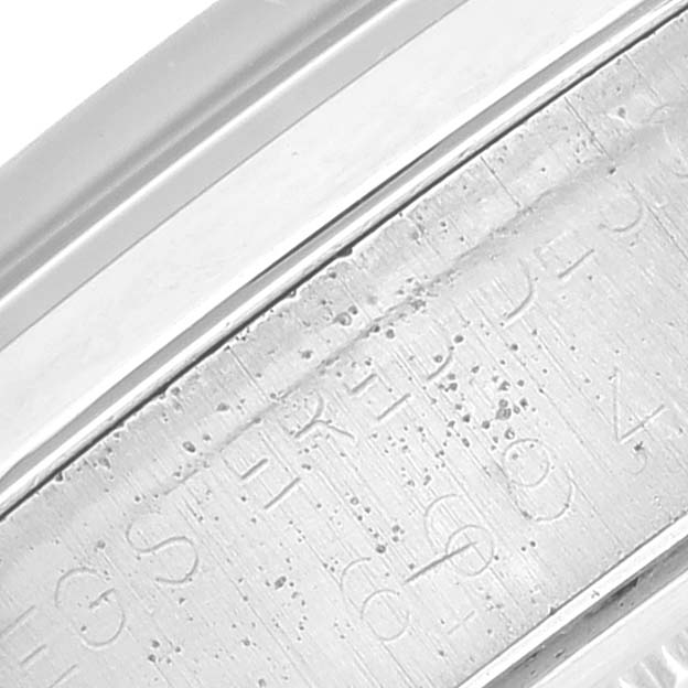 The image shows a close-up of the inner bezel with engraved markings of a Vintage Collection model by Rolex.