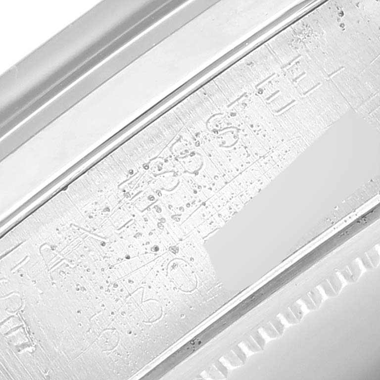 The image shows a close-up angle of the case with visible engravings of the Vintage Collection model by Rolex.