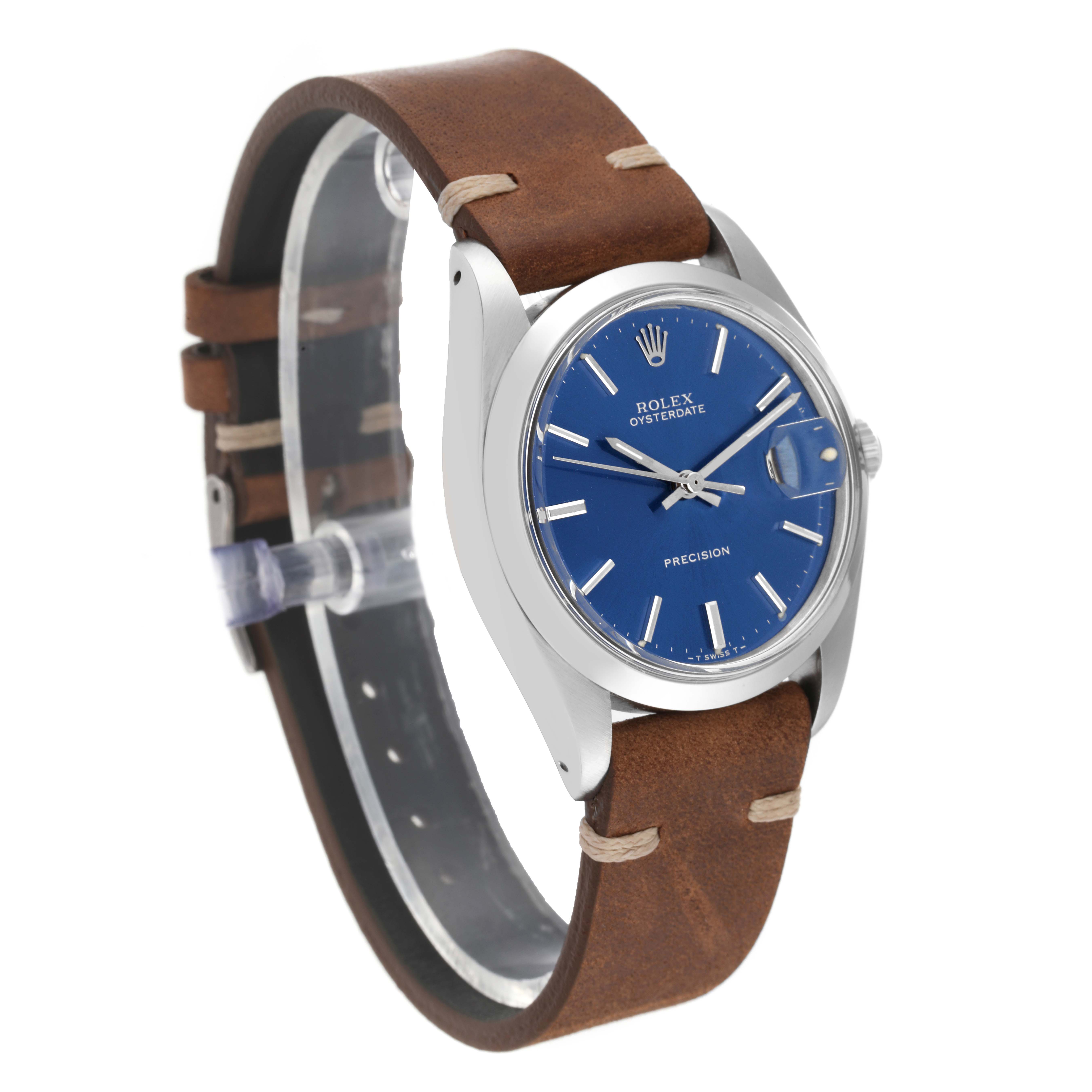 The image shows a Vintage Collection Rolex Oysterdate watch from an angled front view, highlighting its brown leather strap and blue dial.