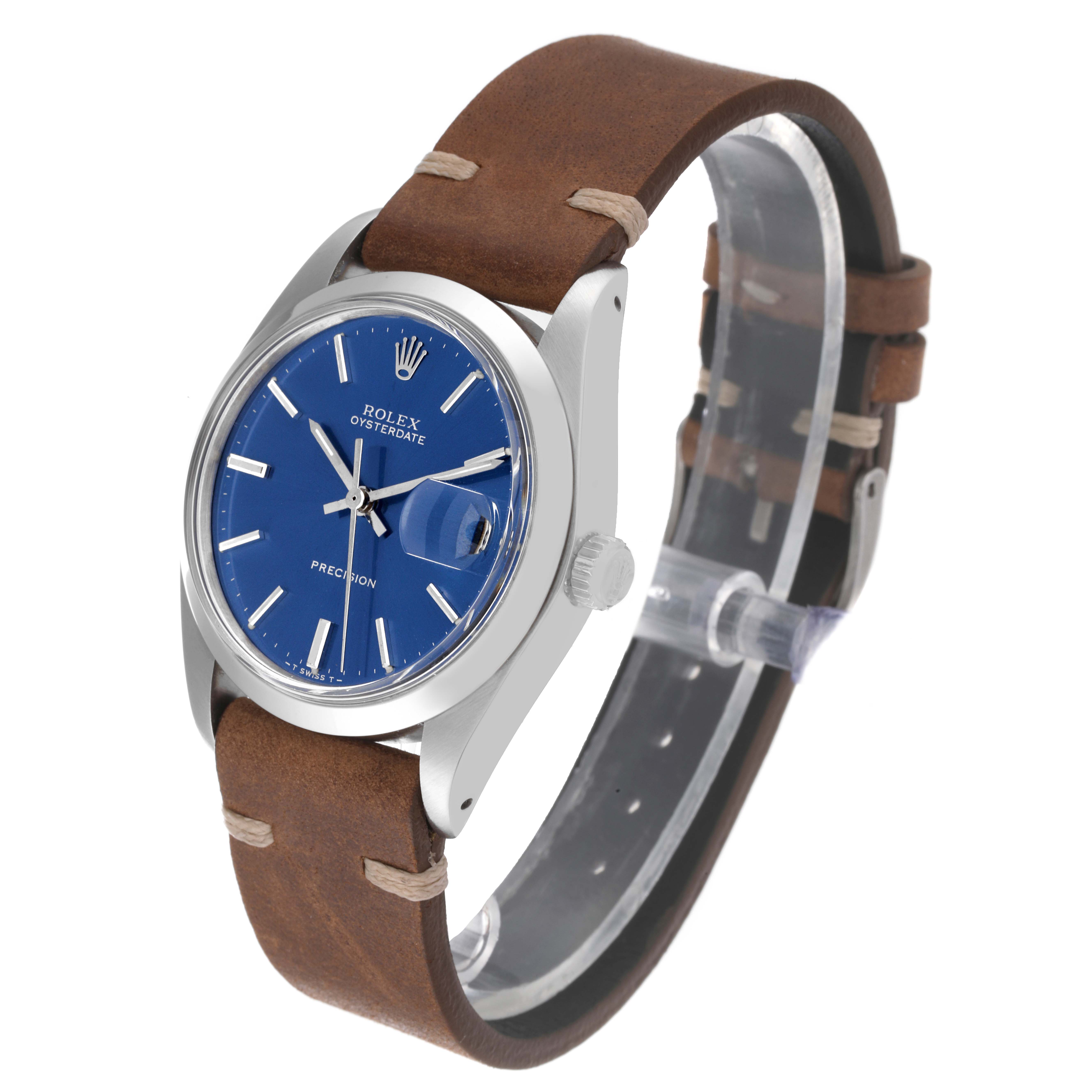 This image shows a Rolex Vintage Collection 6694 Men's Stainless Steel Blue Dial 6694 Men's Stainless Steel Blue Dial model watch, featuring a side angle view with a blue dial and brown leather strap.