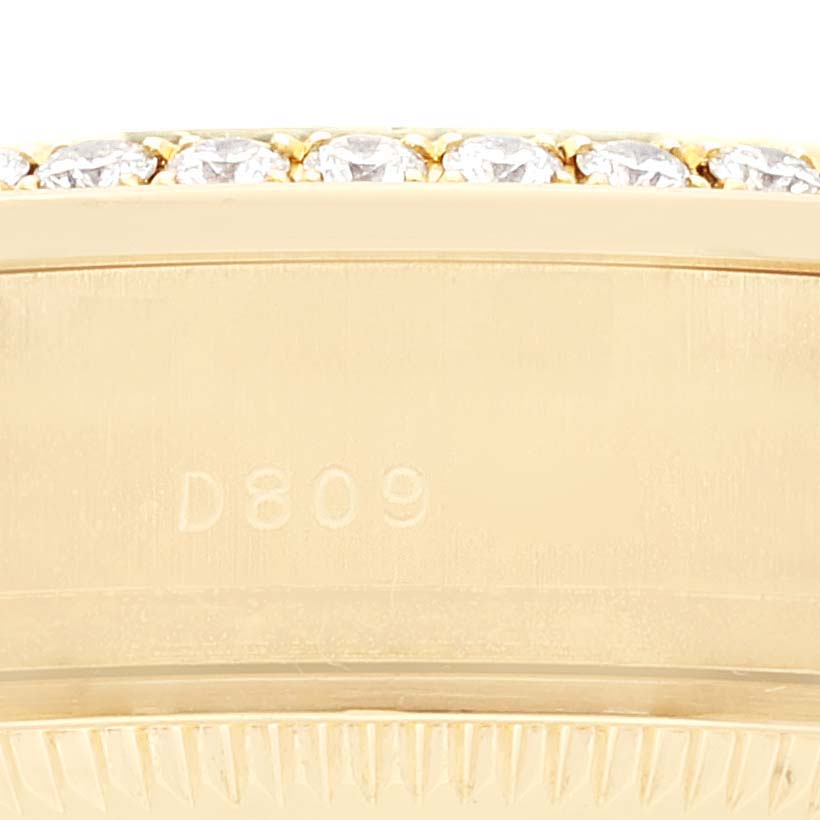 This close-up image shows the side of the bezel and case of a Rolex President 179158 Women
s Yellow Gold Champagne Dial 179158 Women
s Yellow Gold Champagne Dial model watch.