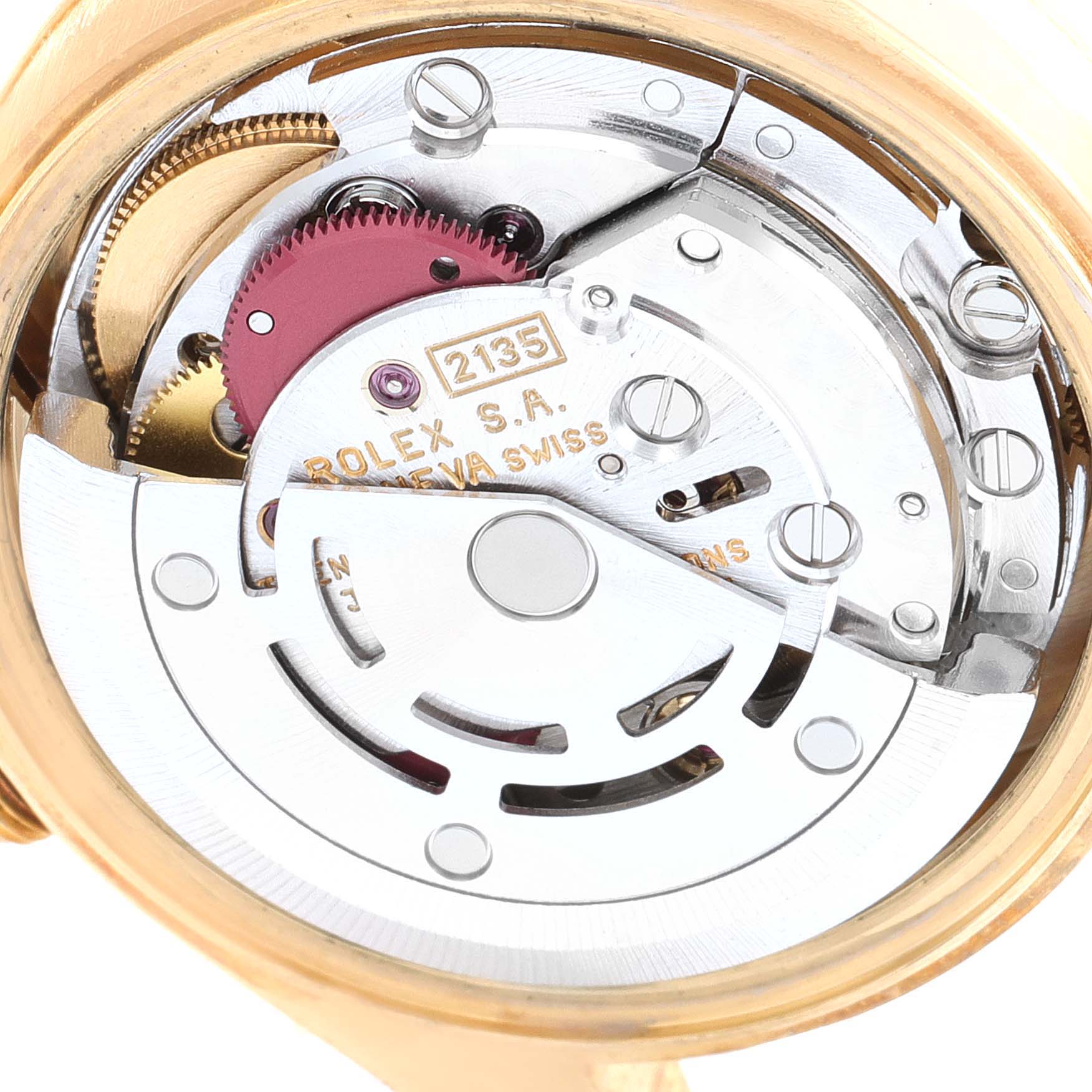 The image shows the intricate internal movement of the Rolex President 69178 Women
s Yellow Gold Champagne Dial 69178 Women
s Yellow Gold Champagne Dial model watch from a close-up angle.