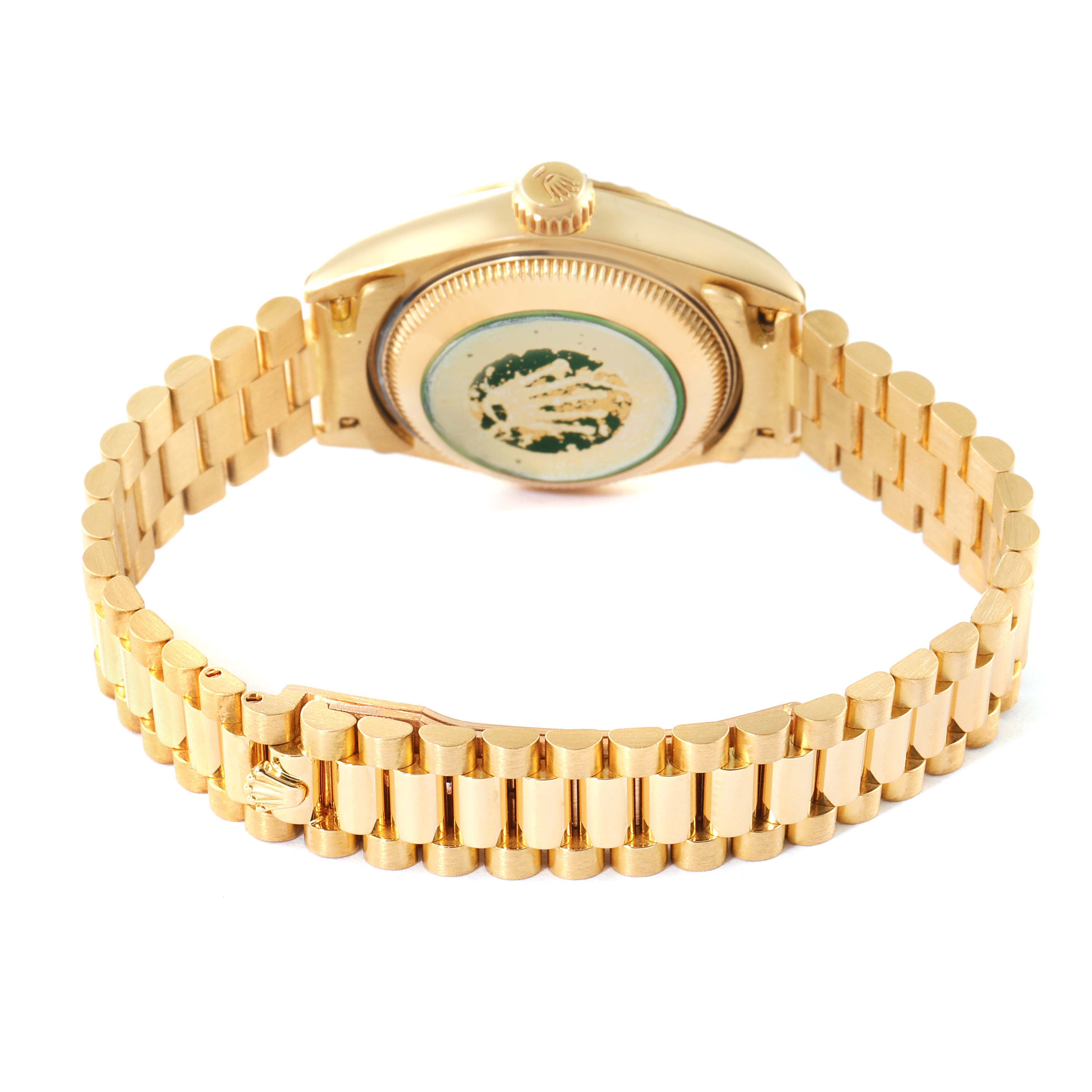 The image shows the back view of a Rolex President 69178 Women
s Yellow Gold Champagne Dial 69178 Women
s Yellow Gold Champagne Dial model watch, highlighting its gold bracelet and case back.
