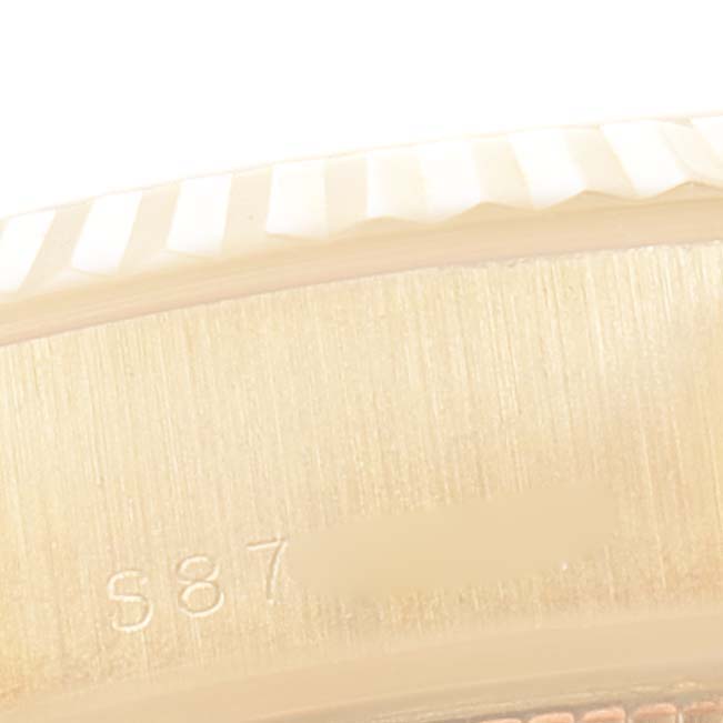 The image shows a close-up of the bezel and part of the case, including some engravings, of a Rolex President 69178 Women
s Yellow Gold Champagne Dial 69178 Women
s Yellow Gold Champagne Dial model watch.