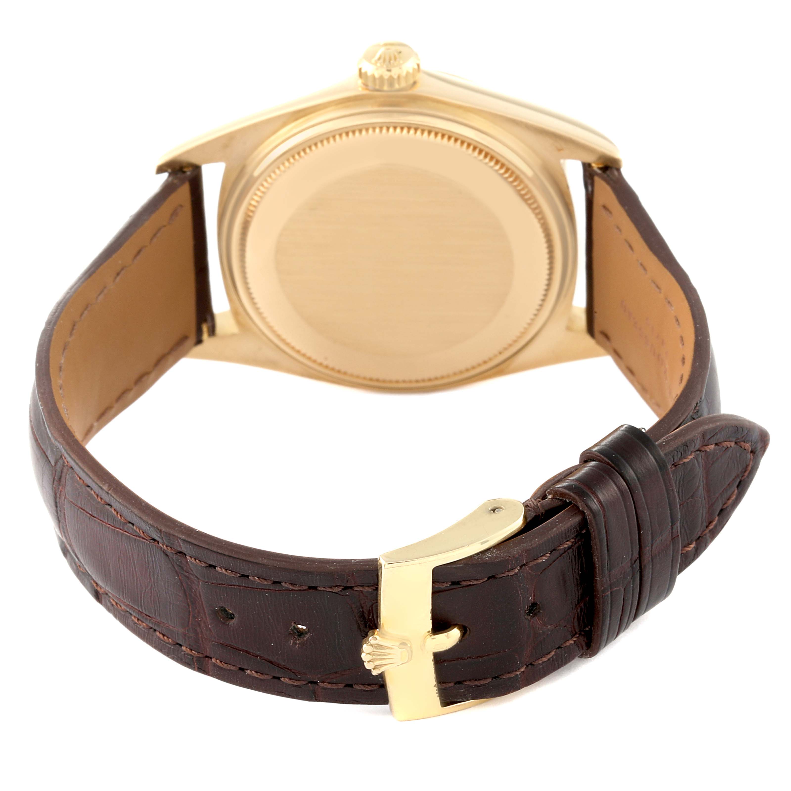 The image shows the back view of the Rolex President 1803 Men
s Yellow Gold Champagne Dial 1803 Men
s Yellow Gold Champagne Dial watch with a gold case and a brown leather strap.