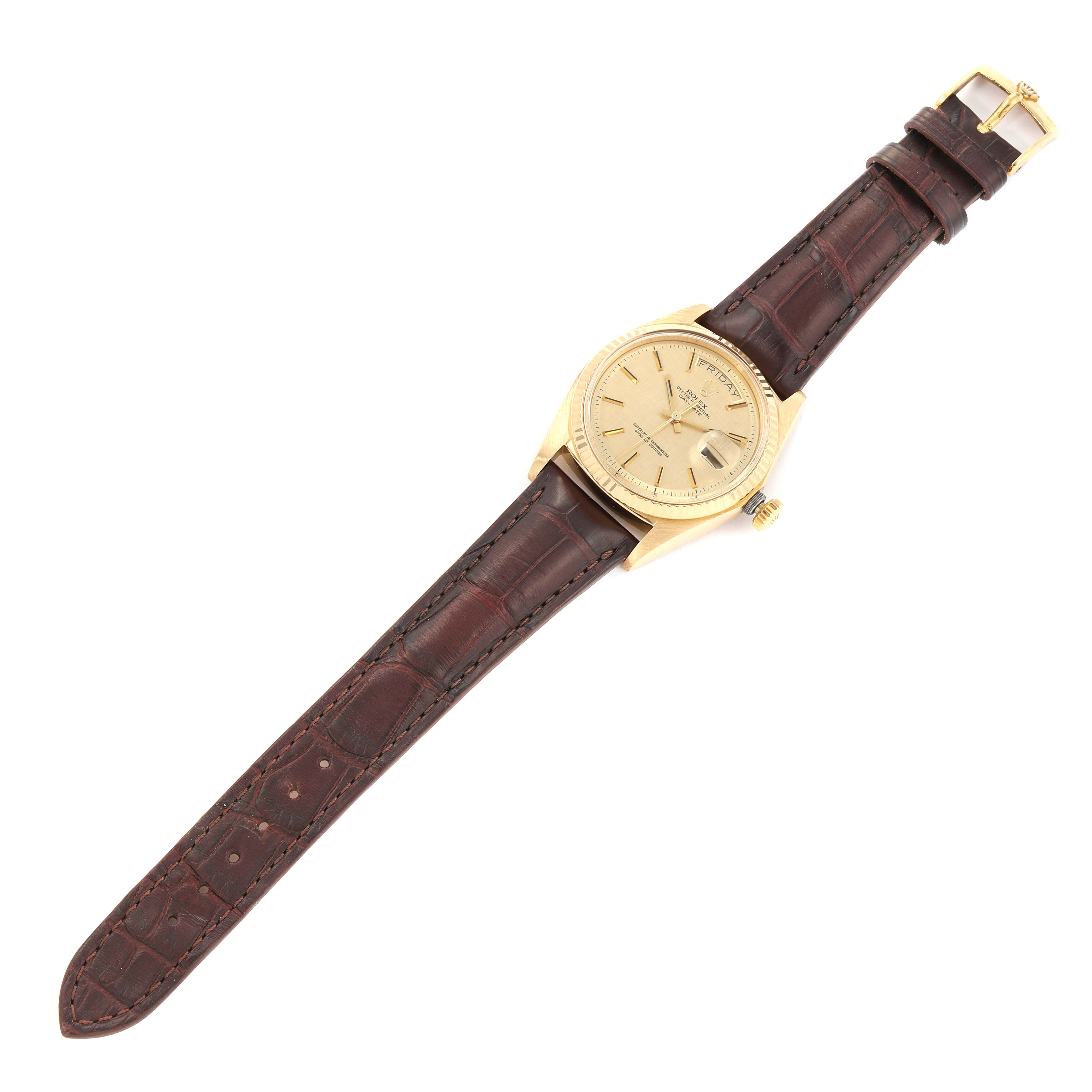 The image shows a Rolex President 1803 Men
s Yellow Gold Champagne Dial 1803 Men
s Yellow Gold Champagne Dial model watch from a top-down angle with a brown leather strap and gold case.
