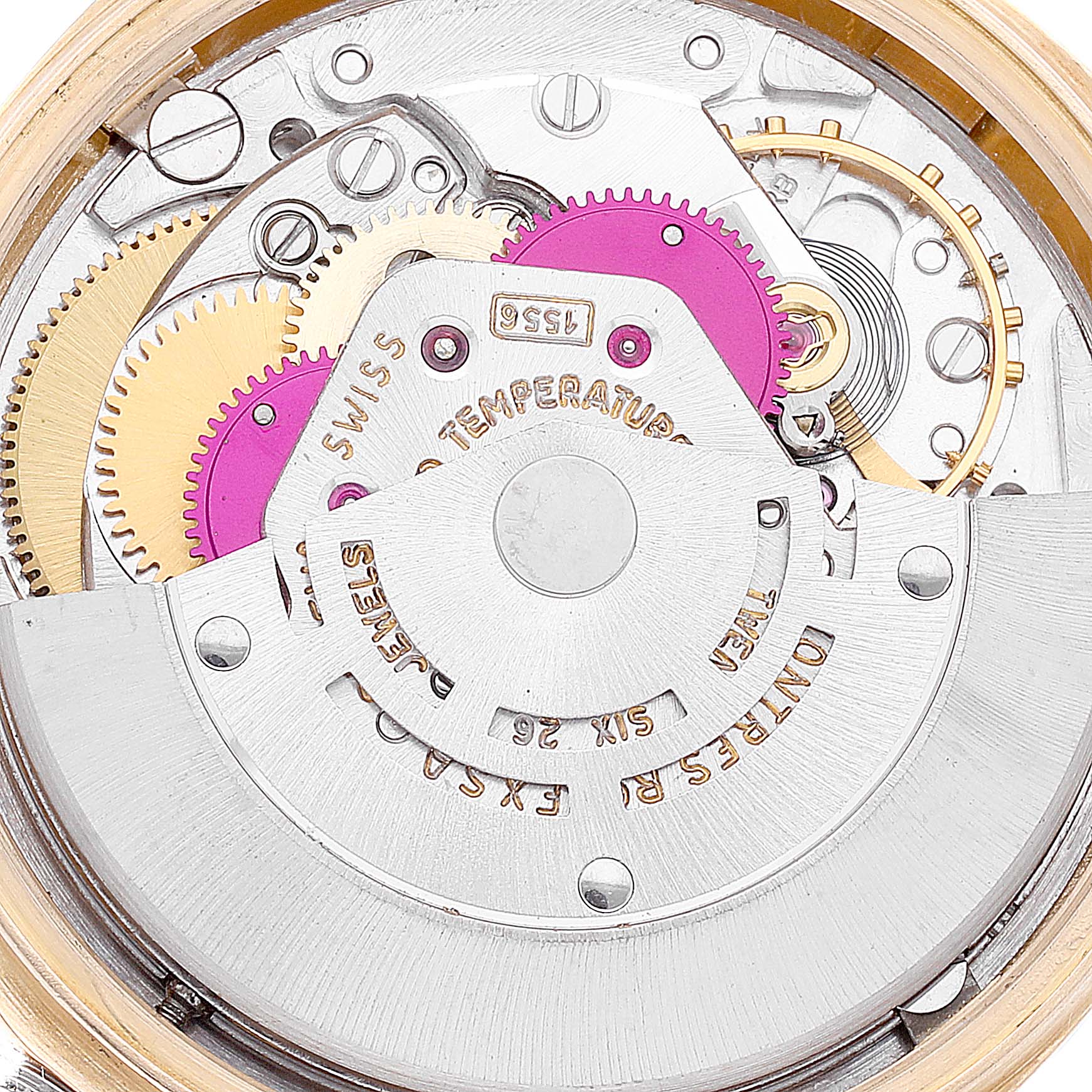 This image shows the inner mechanical components of a Rolex President 1803 Men
s Yellow Gold Champagne Dial 1803 Men
s Yellow Gold Champagne Dial model watch, including gears and the rotor.