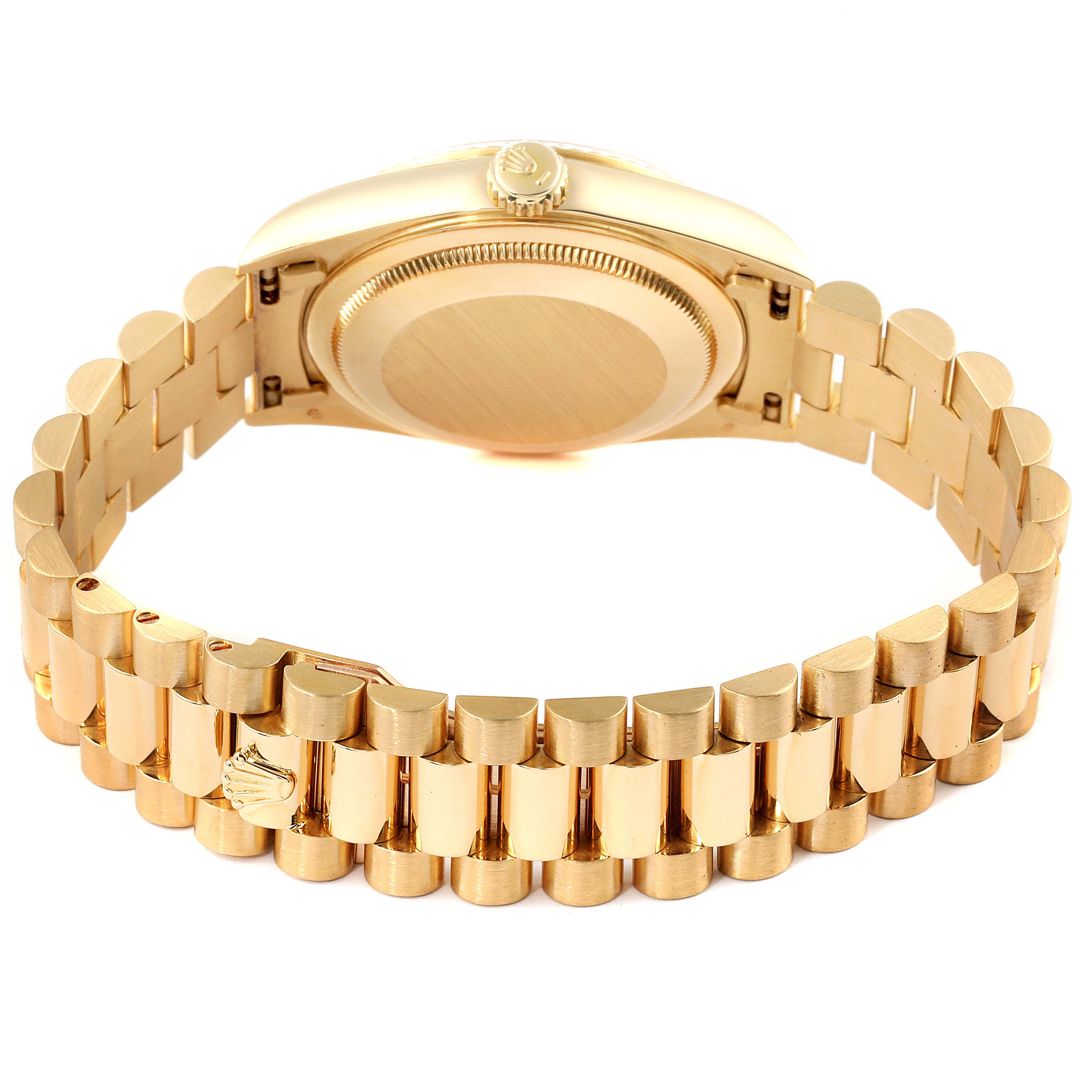 The image shows the backside of a Rolex President 18238 Men's Yellow Gold Champagne Dial 18238 Men's Yellow Gold Champagne Dial model watch, highlighting the case back and the gold bracelet.