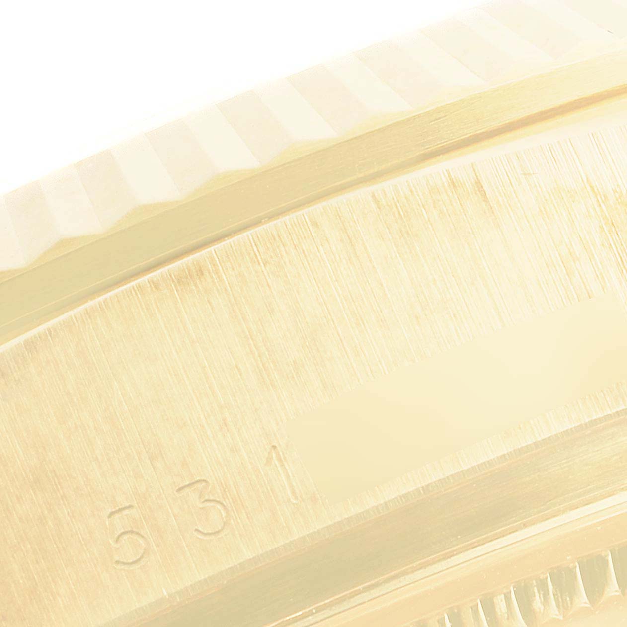 This is a close-up of the side profile of a Rolex President 18038 Men
s Yellow Gold Champagne Dial 18038 Men
s Yellow Gold Champagne Dial model watch, showing details of the bezel and part of the case.