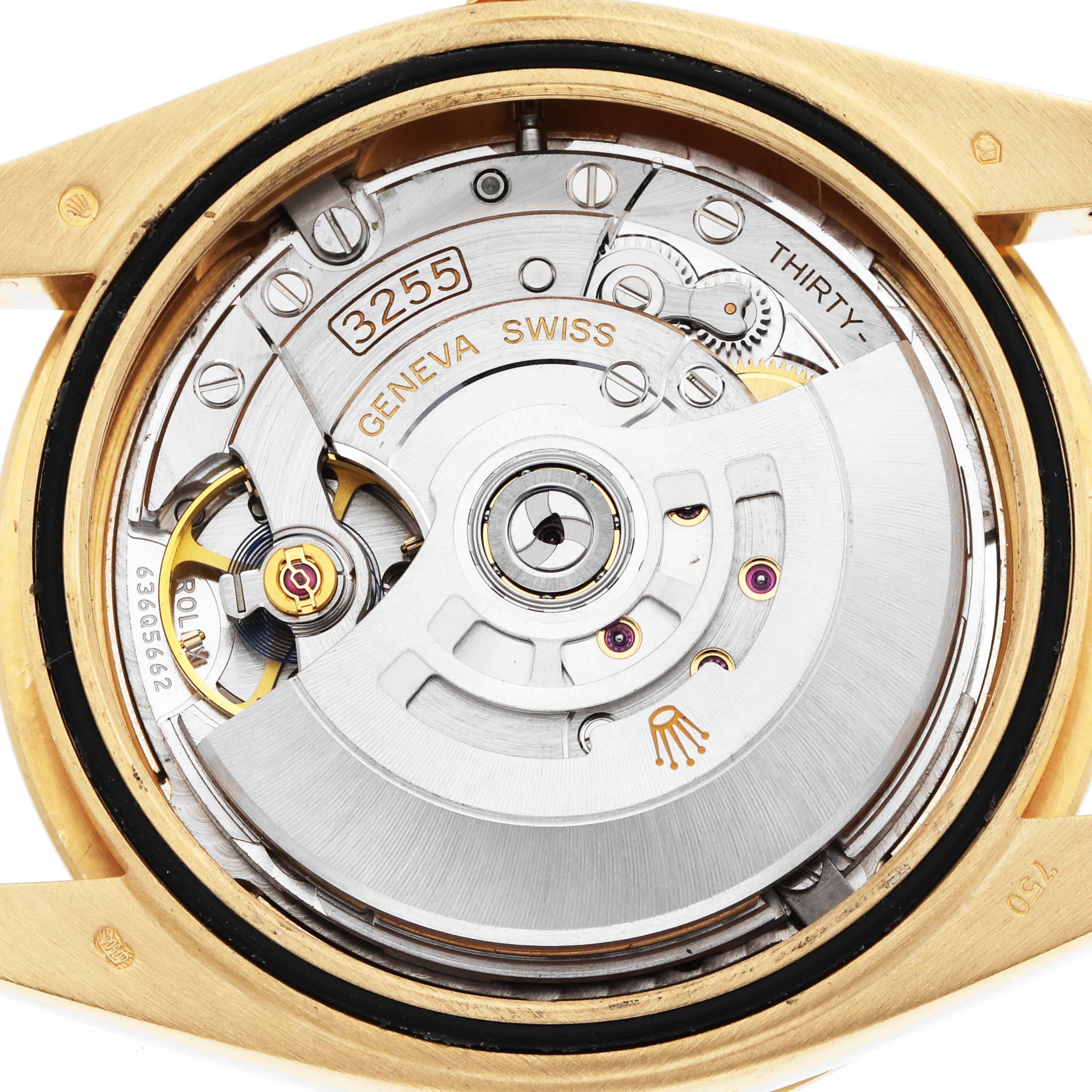 The image shows the movement of a Rolex President 228238 Men's Yellow Gold Silver Dial model watch from the back, highlighting its intricate mechanical components.