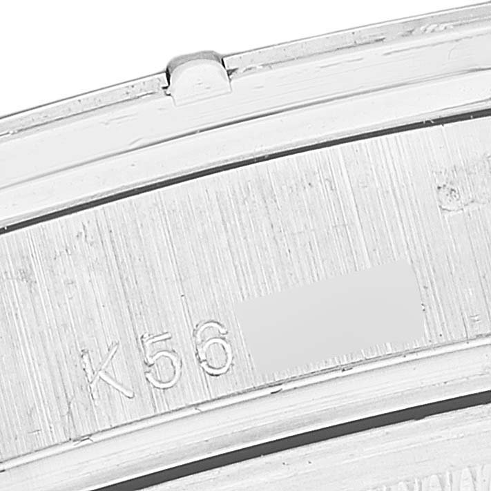 This image shows a close-up of the serial number engraving on the inner side of the case of a Rolex President 118366 Men's Platinum Blue Dial 118366 Men's Platinum Blue Dial model watch.