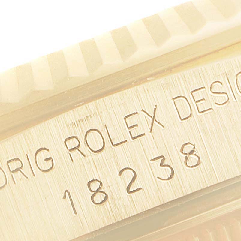 This image shows a close-up view of the side of the Rolex President 18238 Men's Yellow Gold Champagne Dial 18238 Men's Yellow Gold Champagne Dial model, highlighting the engraved model number "18238."