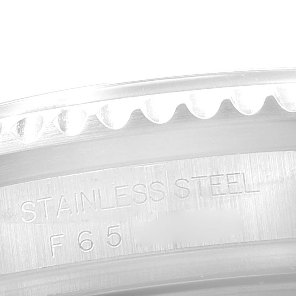 The image shows a close-up of the bezel and case back edge of a Rolex Sea-Dweller 16600 Men's Stainless Steel Black Dial 16600 Men's Stainless Steel Black Dial watch, focusing on the stainless steel engraving.