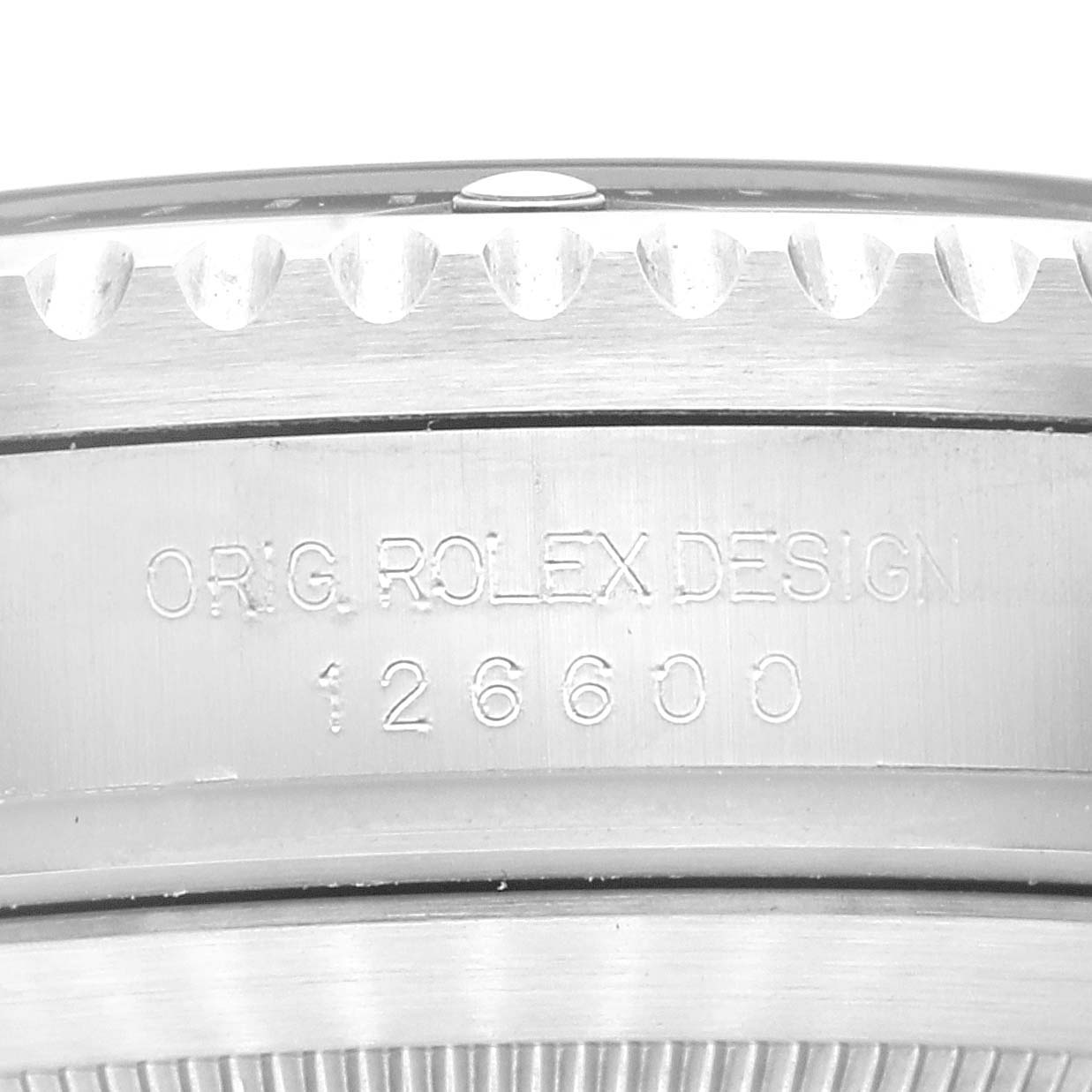 This is a close-up of the side of the Rolex Sea-Dweller 126600 Men's Stainless Steel Black Dial 126600 Men's Stainless Steel Black Dial, showing the model number 126600 and "ORIG ROLEX DESIGN" engraving.