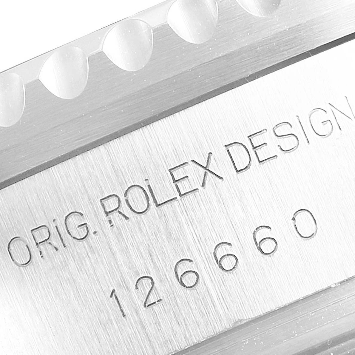 This close-up image shows the engraved model number and "Orig. Rolex Design" text on the case of the Rolex Sea-Dweller 126660 Men's Stainless Steel Blue Dial 126660 Men's Stainless Steel Blue Dial watch.