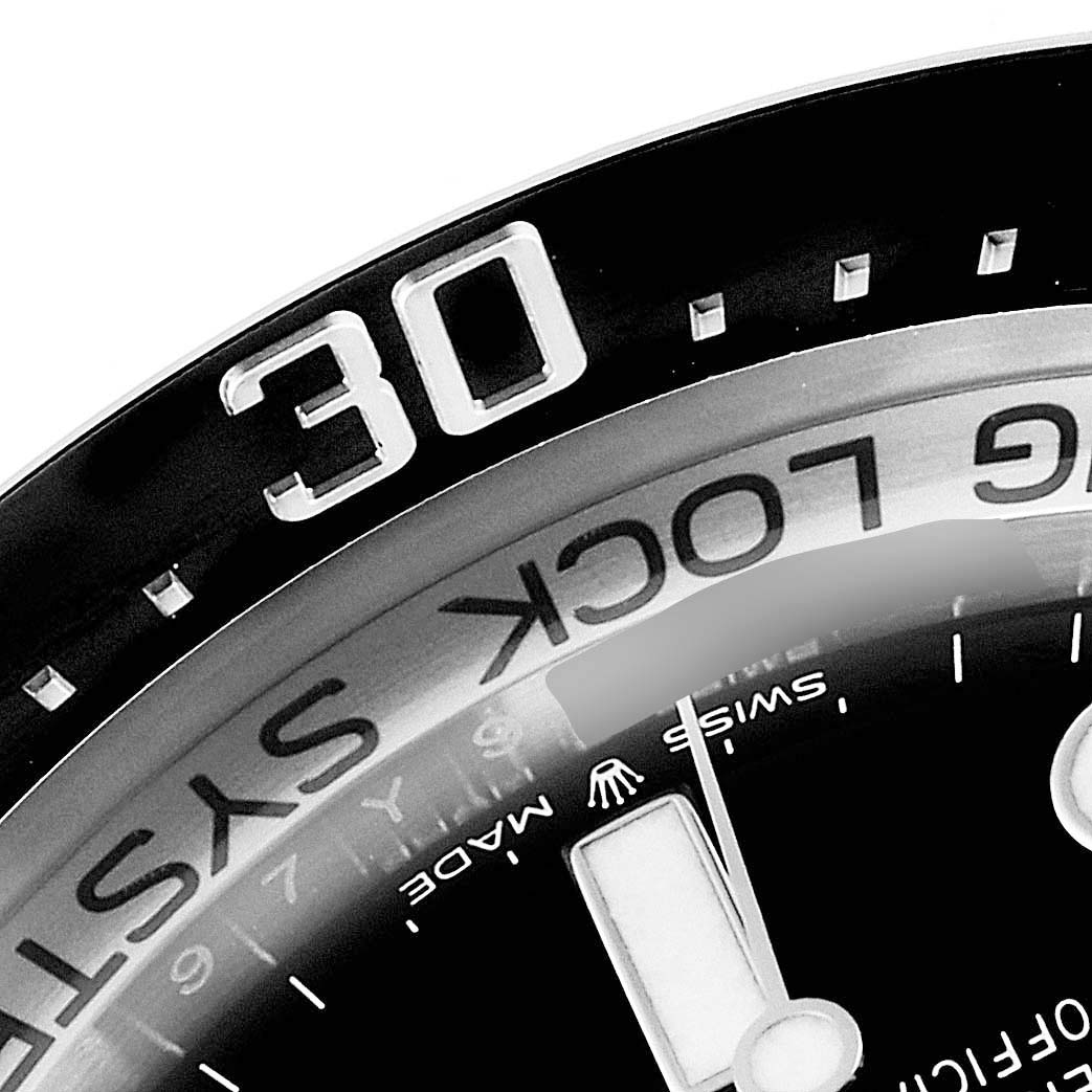 This image shows a close-up of the bezel, minute hand, and part of the dial of a Rolex Sea-Dweller 126660 Men's Stainless Steel Blue Dial 126660 Men's Stainless Steel Blue Dial watch.