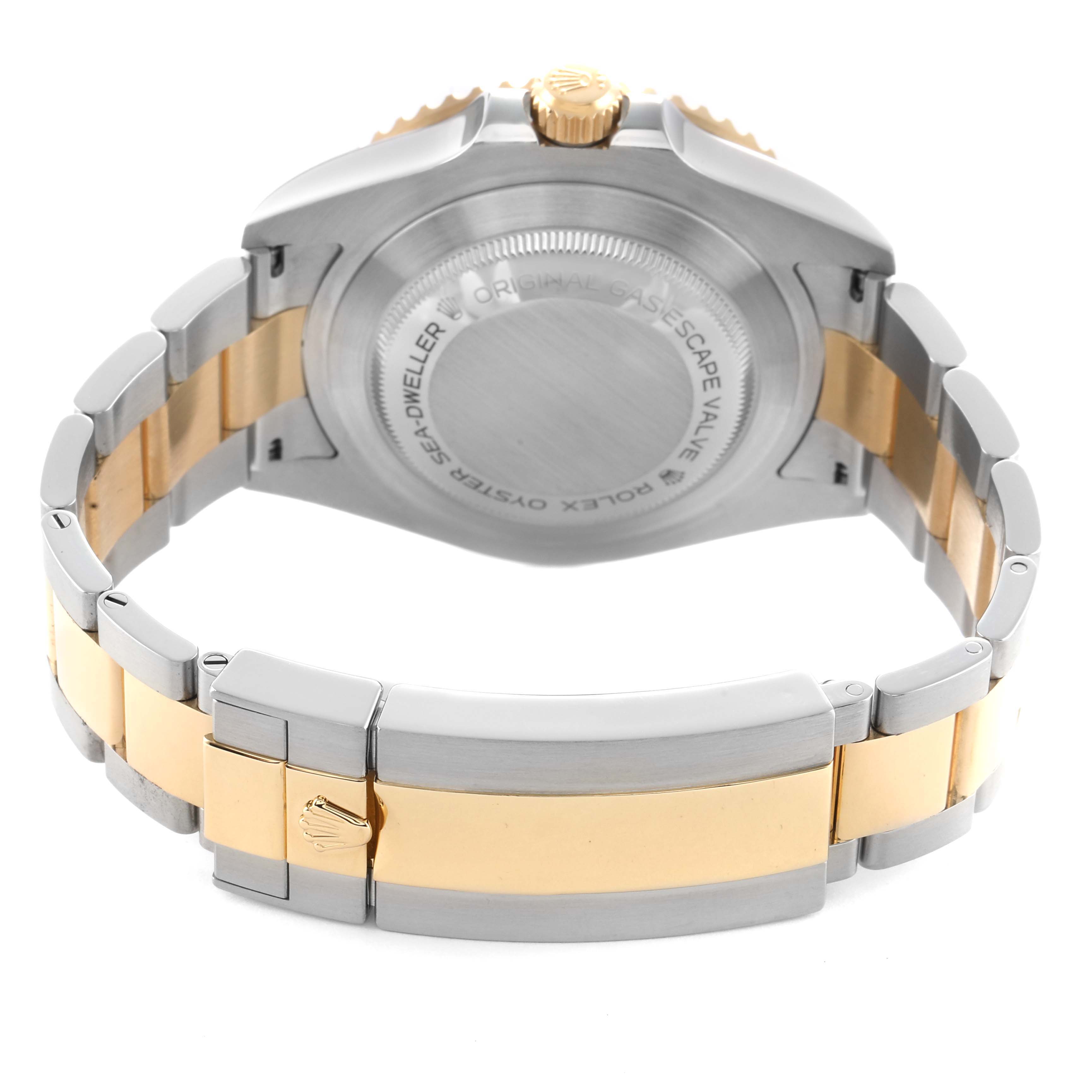 The image shows the back case and bracelet of a Rolex Sea-Dweller 126603 Men's Steel and Gold (two tone) Black Dial, highlighting its two-tone design and clasp.